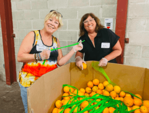 Laurie and Jennifer volunteer at the Food Bank 
